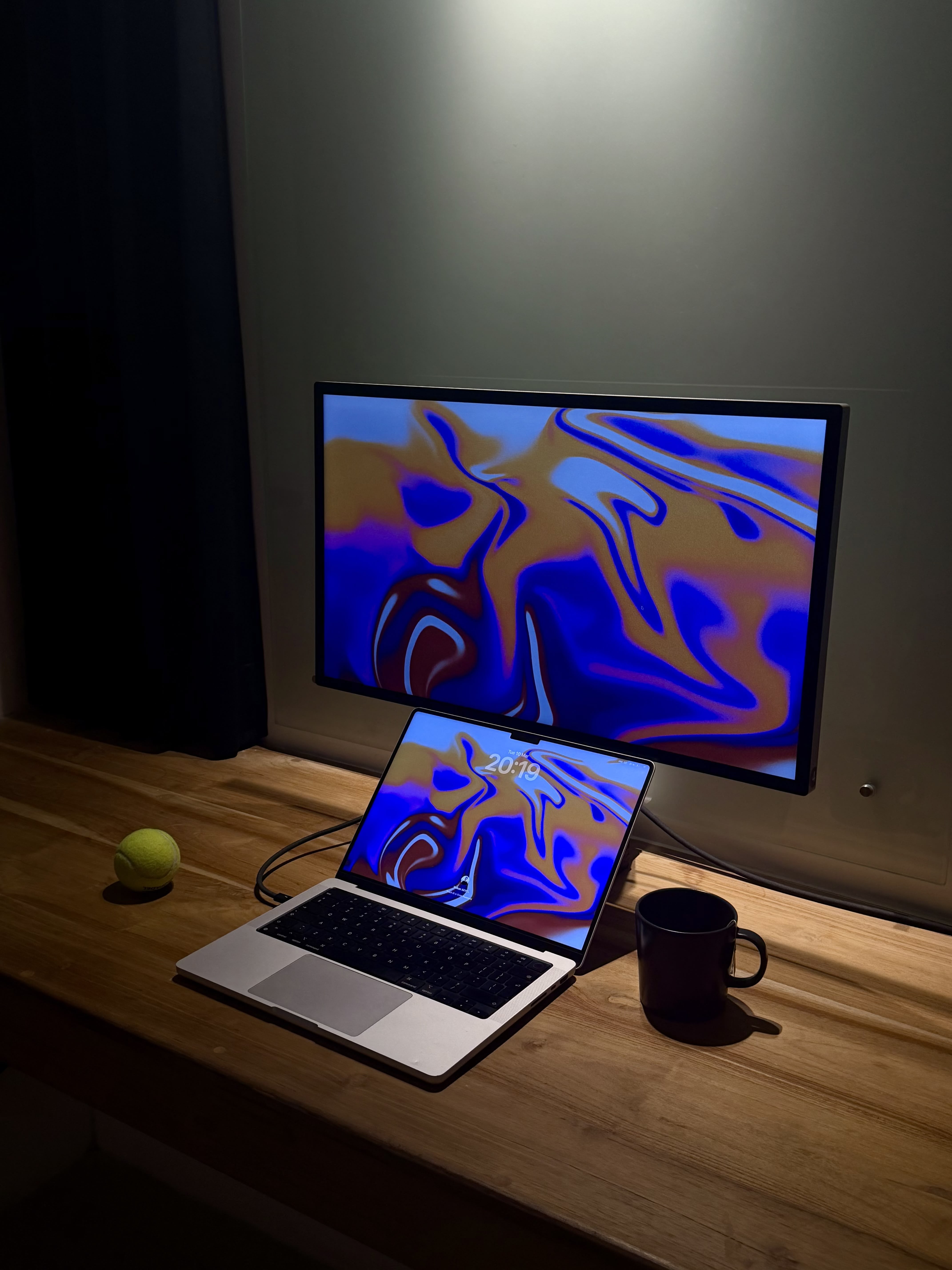 Desk setup with monitor, keyboard and studio light
